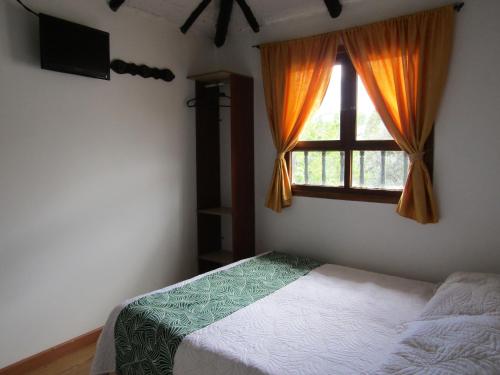 Una cama o camas en una habitación de La Casona Nuñez