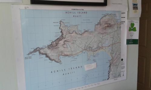 a map of australia hanging on a wall at Achill West Coast House in Dooagh