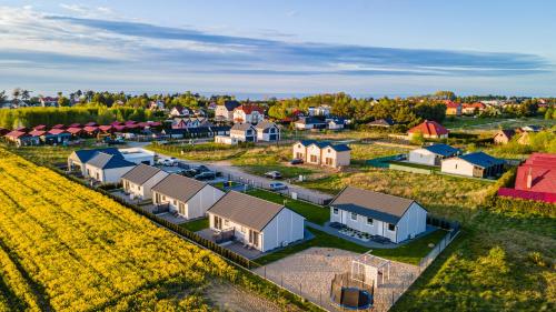 an aerial view of a small town with houses at Szara Gąska w Gąskach in Gąski