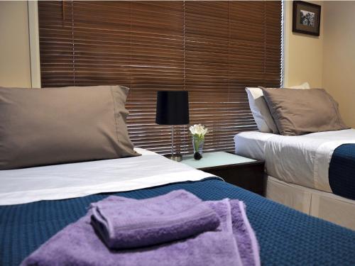 Cama o camas de una habitación en TL Warmest Homestay