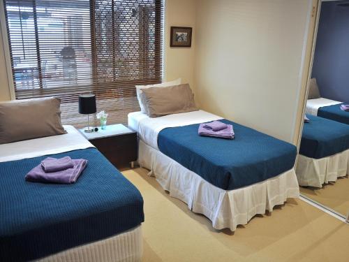 Cama o camas de una habitación en TL Warmest Homestay