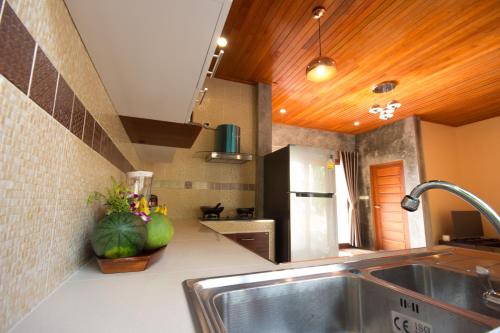 a kitchen with a sink and a counter top at Baan View Talay Pool Villas in Thong Nai Pan Yai