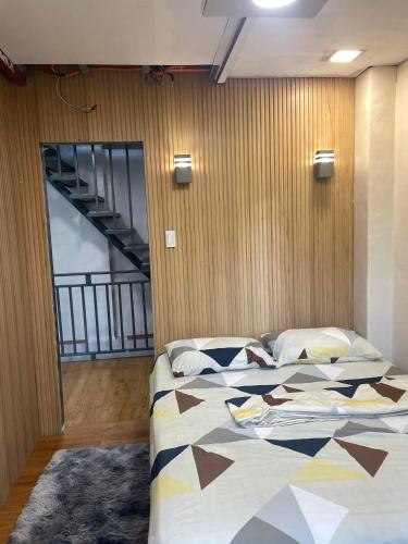 a bedroom with a large bed in a room at Pine's View Casa Isabel Villa Staycation - Marilog, Davao City in Kayagan