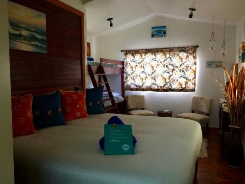 a bedroom with a bed with a sign on it at Kalani Hawaii Private Lodging in Pupukea
