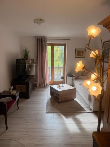 a living room with a couch and a coffee table at Apartment Ape Maja in Bad Wiessee