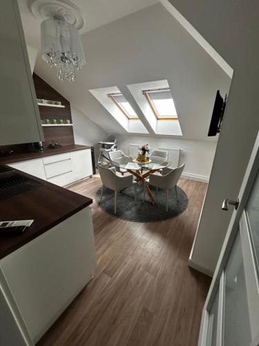 a kitchen and dining room with a table and chairs at The Manor in Pilsen