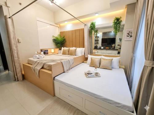 a bedroom with two beds in a room at Midtown Cebu City Condo in Cebu City