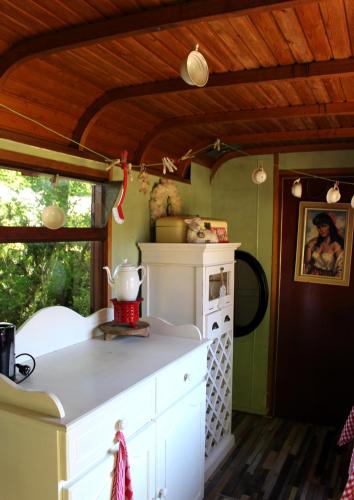 a kitchen with a white counter top in a room at Landgoedboerderij Oosterheerdt in Leek