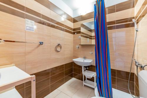 a bathroom with a sink and a shower at Bed & Breakfast Haus Lucija in Baška
