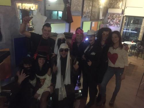 a group of people posing for a picture at a party at Anahuaska Art - Suites Temáticas in Panzares