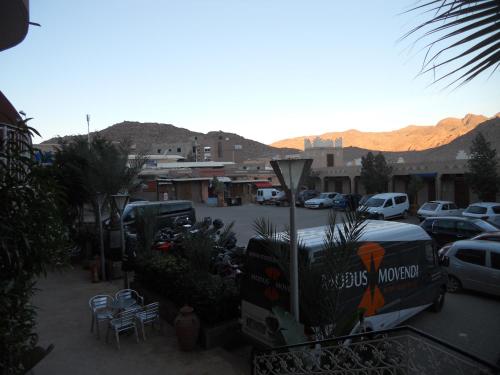 a parking lot with a bus parked in a parking lot at Hotel Salama STE SAL- AMA SUD SARL AU in Tafraout