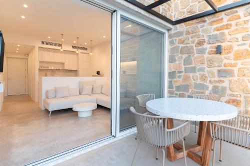 a living room with a couch and a table at Gialova Hills 8 in Gialova