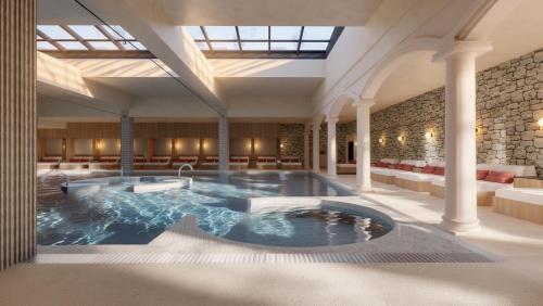 a large indoor hot tub in a large building at Castilla Termal Palacio de Avellaneda in Peñaranda de Duero