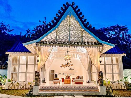 a home with a large gazebo at Hafrana Villa by AGATA - 700sqm 2BR Villa with Private Pool & Jacuzzi in Sidemen
