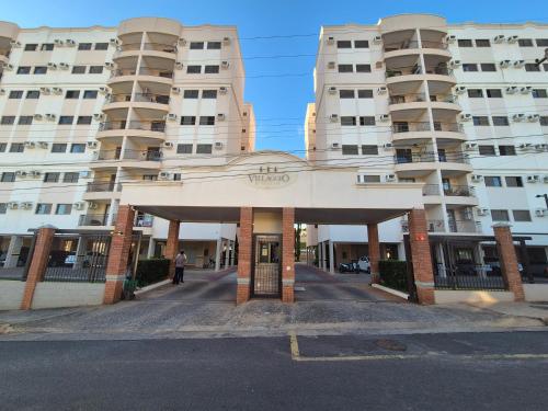 a building with a gate in front of it at Olímpia Temporada Cond. Villagio in Olímpia