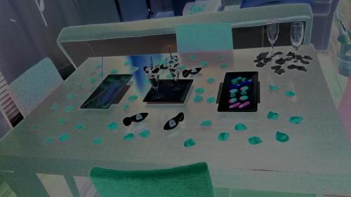 a table with shoes and glasses and a green chair at Anahuaska Art - Suites Temáticas in Panzares