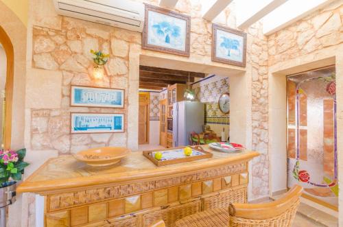 a kitchen with a counter and a refrigerator at Na Pont in Campos