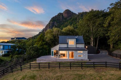a tiny house on the side of a hill at Reotahi Bolthole in Whangarei Heads