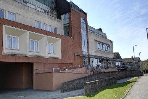 a large brick building with a staircase in front of it at Sure Hotel by Best Western Aberdeen in Aberdeen