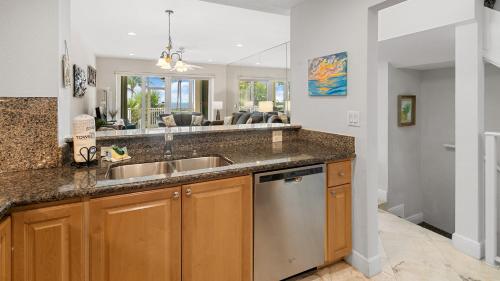 a kitchen with a sink and a counter top at 405 Mariners Club in Key Largo