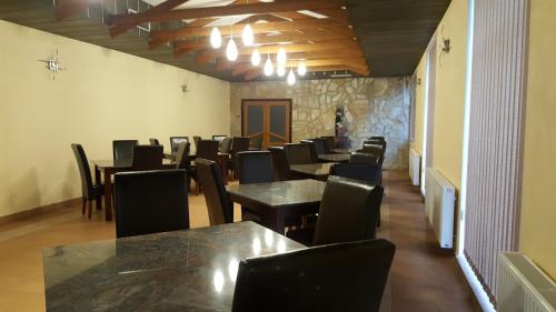a row of tables and chairs in a dining room at Penzion 324 in Štoky