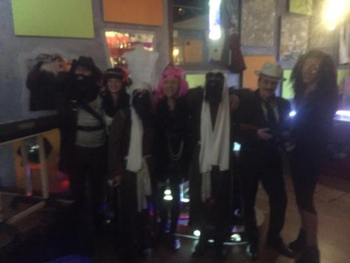 a group of people posing for a picture at a party at Anahuaska Art - Suites Temáticas in Panzares