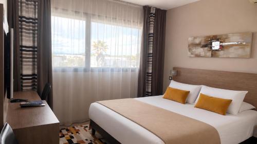 En eller flere senge i et værelse på Forme-hotel & Spa Montpellier Sud-Est - Parc Expositions - Arena