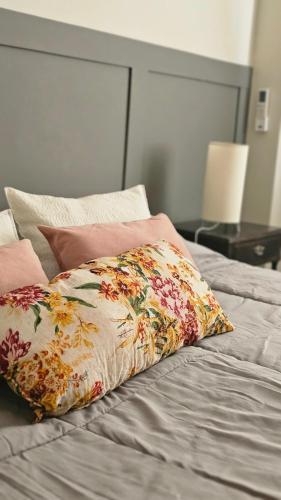 a bed with a pillow on top of it at En Espejo in Mendoza