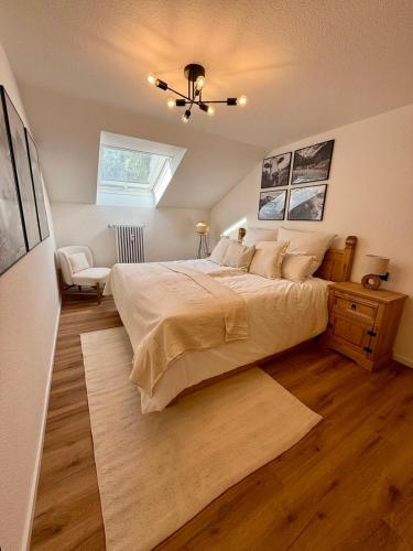 a bedroom with a large bed and a window at Bergheimat Stüble Allgäu in Bad Hindelang