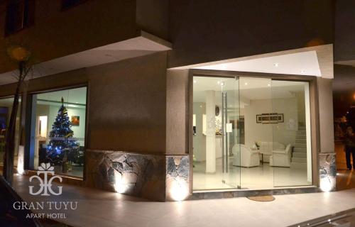 a living room with a christmas tree in a building at Gran Tuyu in San Clemente del Tuyú