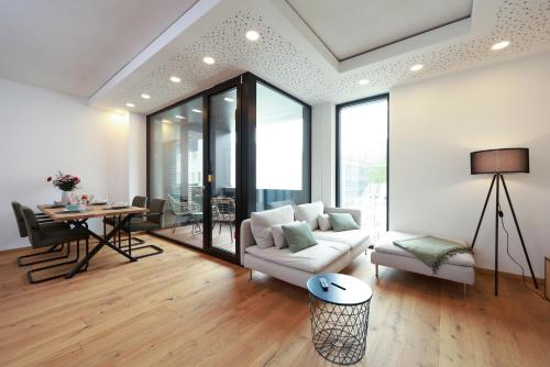 a living room with a couch and a table at Alte Weberei in Marktredwitz