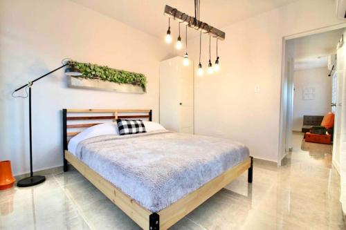 a bedroom with a bed in a room at 1.6 • Balcony • Generator • Parking • 2nd Floor in Mayaguez