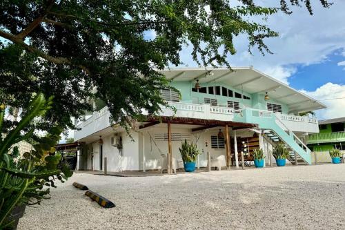 a building with a staircase in front of it at 3.9 Near Beach • Generator • Hammock • 1st Floor in Garita