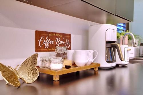 a kitchen counter with a butterfly on a table at 5.7 Penthouse • Generator • Parking • 3rd floor in Mayaguez