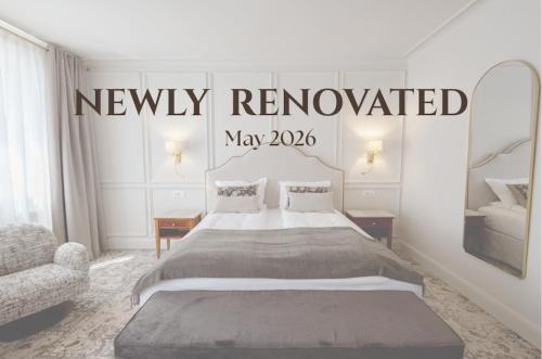 a bedroom with a bed and a sign that says newly renovated at Hotel La Residenza - Adults only in Timişoara
