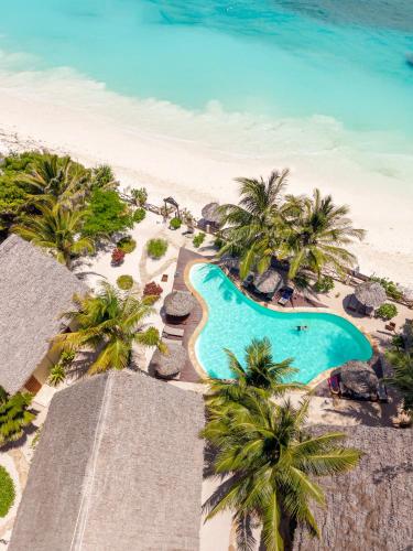 an aerial view of the beach and swimming pool at the resort at Clove Island Villas & Spa in Makunduchi