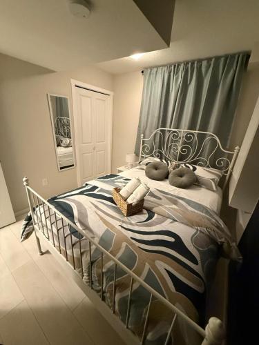 a bedroom with a bed with two pillows on it at The Urban Nest 2 in Calgary