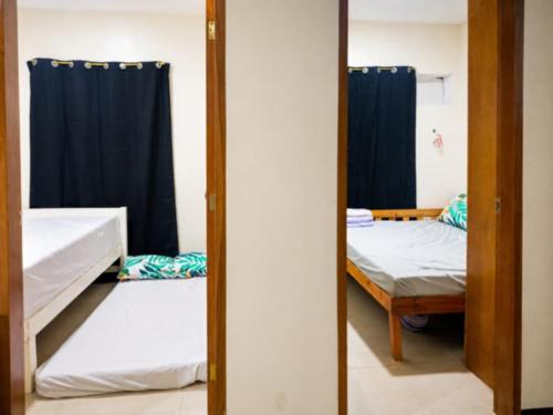 a mirror in a room with two bunk beds at Zoldyck Villa 1 in Bacolod