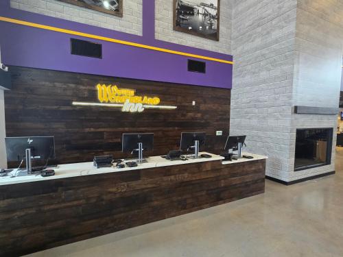 a waiting room with four sinks and a fireplace at Dutch Wonderland Inn in Lancaster
