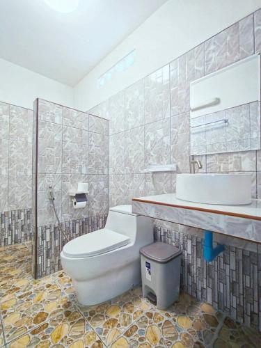 a bathroom with a toilet and a sink at Rimlay Bay View 2 in Ko Yao Noi