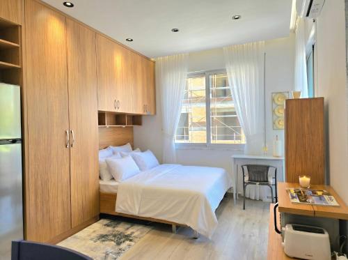 Llit o llits en una habitació de Le Petit Studio 098
