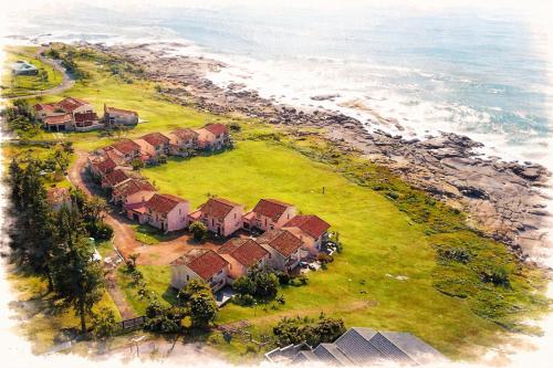 an aerial view of a house on the beach at Rockshore at Seaverge in Port Edward