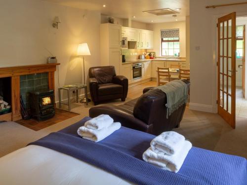 a living room with two beds and a couch at 1 Bed in Applecross oc-ca186 in Applecross