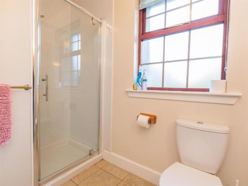 a bathroom with a shower and a toilet at 1 Bed in Applecross oc-ca186 in Applecross