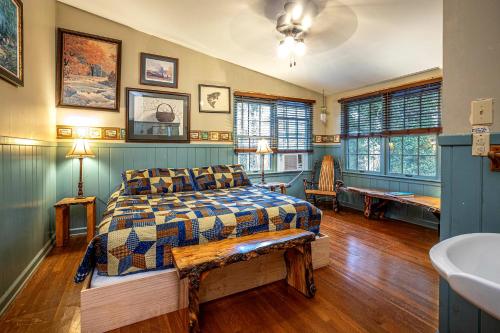 a bedroom with a bed and a sink in it at The Lodge in Helen