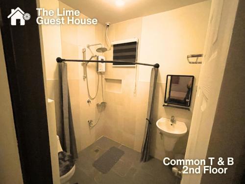 a bathroom with a shower and a sink at The Lime Guesthouse in Angeles