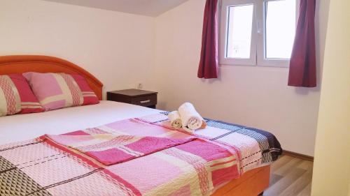 A bed or beds in a room at Apartments Mila Tivat