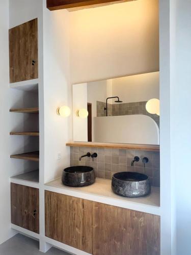 two sinks in a bathroom with a mirror at Es Campet, charmante finca, Soller, Vue splendide, piscine, calme in Sóller