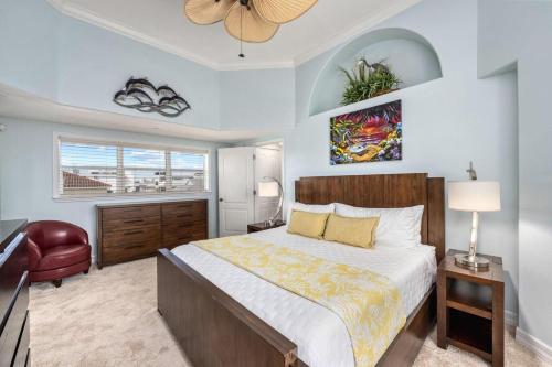 a bedroom with a large bed and a window at Admirals Watch - 673 in Siesta Key