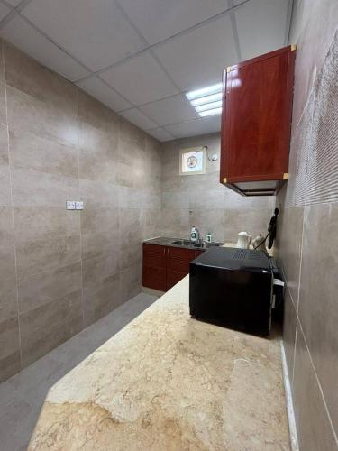 a kitchen with a counter and a sink in it at thedesert08 in Ras al Khaimah